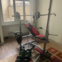 دستگاه ۴۲ کاره بهمراه وزنه و هالتر و دمبل