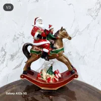 مجسمه بابانوئل با اسب راکر