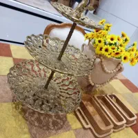 شیرینی خوری سه طبقه و مجسمه برنز