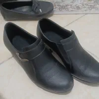 چند جفت کفش|کیف، کفش، کمربند|گلبهار, شهر جدید گلبهار|دیوار