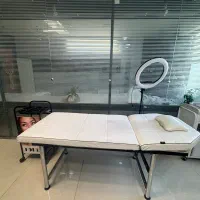 تخت ماساژ و خدمات زیبایی به همراه ترولی