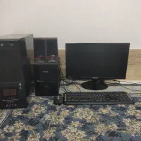کامپیوتر با مانیتور و اسپیکر و کیبورد و موس