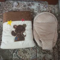 کیسه خواب وآغوشی نوزاد