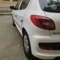 پژو207سفیدبیرنگ مدل 99فرمان برقی مشابه صفر