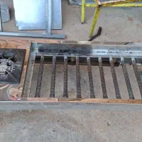 منقل گازی همراه با شعله برای پخت غذا