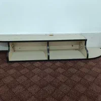 میز تلویزیون دیواری و چمدان