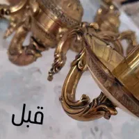 تمیزکاری و برق انداختن لوسترهای برنزی