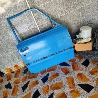 درب سمت شاگرد نیسان بی رنگ  بدون تاب وجوش