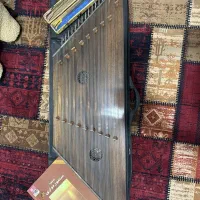 سنتور مضراب و کتاب