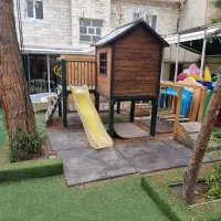 فروش کلبه چوبی باترکیب سرسره و صخره نوردی