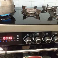 اجاق گاز طرح فر فندک سر خود تایمردار زنگ و ساعت