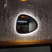 آینه دفرمه چوبی طرح مشبک