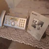 یک دستگاه فاکس sharp و یک دستگاهdvd plyer  مارشال