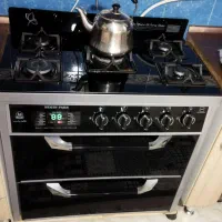 میز تلویزیون شیشه ای و گاز