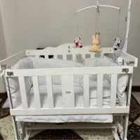 گهواره تخت کنار مادر