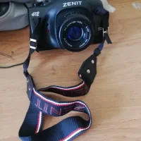 دوربین عکاسی زنیط و فلش و سه پایه