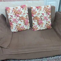 یک عدد مبل دو نفره و جلو مبلی