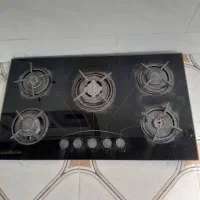 اجاق گاز صفحه ای پنج شعله ومیز تلویزیون