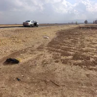 زمین 3500متری کنار جاده کرمانشاه هلشی