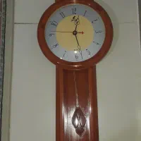 ساعت دیواری پاندول دار سالم طرح چوب