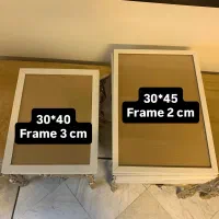 تعدادی قاب عکس سفید و مشکی و قهوه ای سایز بزرگ