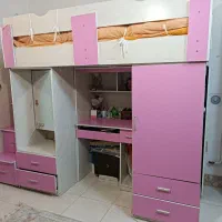 تخت دو طبقه کم جا دارای میز تحریر ،میز آرایش و کمد