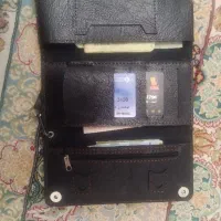 یه کیف پول با کارت و کارت ملی به نام فاطمه کوهشاری