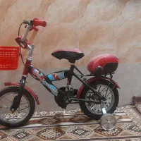 دوچرخه ۱2 قرمز تمیز و کاملآ سالم|دوچرخه، اسکیت، اسکوتر|اصفهان, شهید رجایی|دیوار
