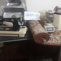 تعدادی لوازم چرخ خیاطی قالیچه چهارگوشی تلفن ثابت