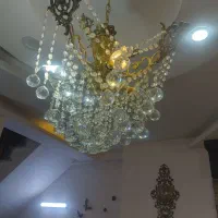 لوستر برنز و ساعت و میز