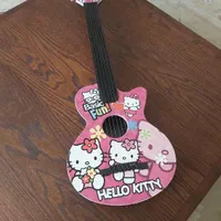 گیتار و عروسک hello kitty