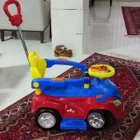 یک عدد ماشین دسته دار کودک