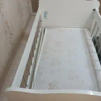 گهواره کنار تخت مادر