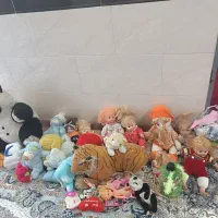 اسباب بازی و عروسک آواز خوان همراه لباس عروسک ها