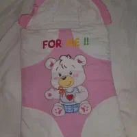 کیسه خواب وپتو دور پیچ نوزاد دخترانه