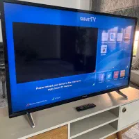 تلویزیون ۴۹ اینچ ایکس ویژن به همراه میز