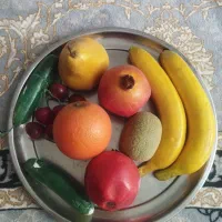 کفش بچه گانه و میوه مصنوعی