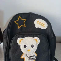 سه عدد کوله پشتی|کیف، کفش، کمربند|قم, قلعه کامکار|دیوار