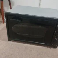 یک عدد توستر دارای دوسینی مناسب برای کیک وپیتزا