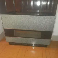 حراج  بخاری سرویس چینی 8 نفره و چرخ خیاطی  توافقی