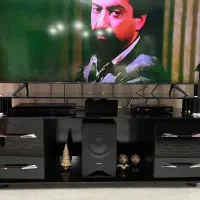 میز زیر تلویزیون شیشه ای