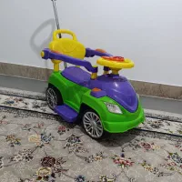 ماشین چهار چرخ دسته دار