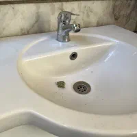 روشویی کمد دار و شیر