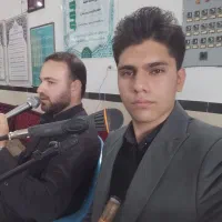 مداح به همراه نوازنده گروه آریانژاد