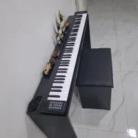 پیانو تاشو بهمراه میز و صندلی