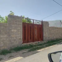 فروش زمین دو نبش روستای بازوند+باغچه چهار دیواری