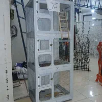 قفس پرنده با سطل زباله