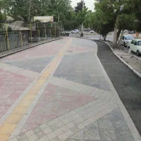 اجرای تایل فرش جدول کاری سنگ لاشه تاوه