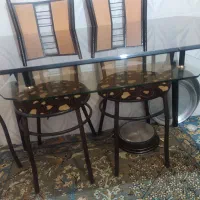 میز غذاخوری شیشه ده میل وپایه فلزی کوره ای