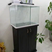 آکواریوم و میز و پمپ هوا و...